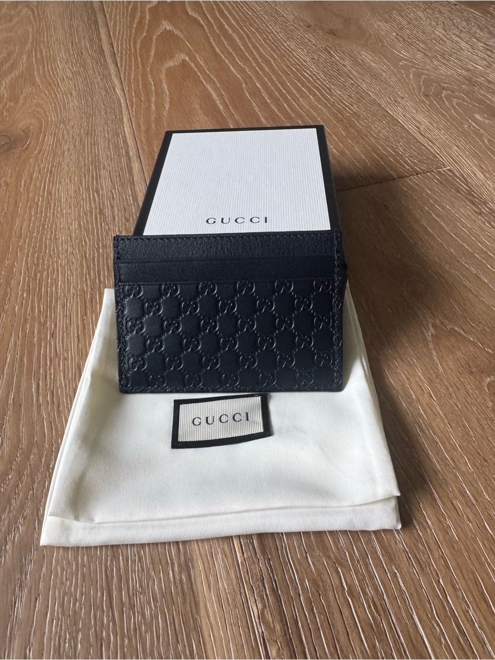 Gucci Black GG Embossed Leather Card Case